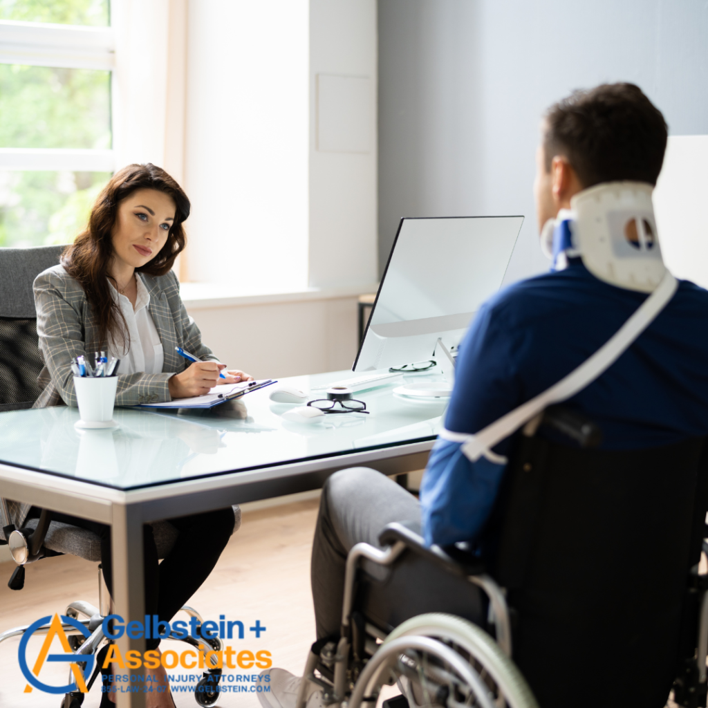 Person in a neck brace in a wheelchair at a lawyer's office.