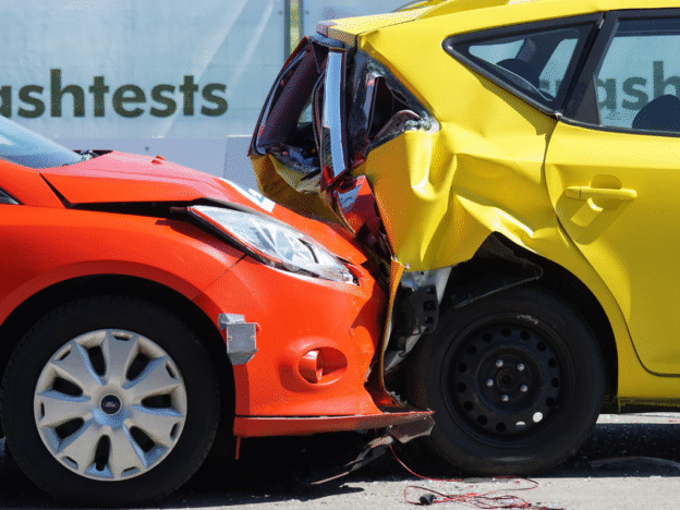 A Rear End Car Accident Between an Orange Car and a Yellow Car